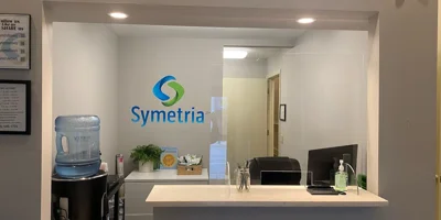 Reception area with Symetria Recovery logo.