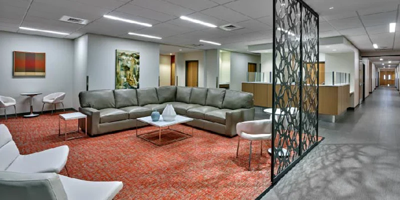 Large waiting area with reception and offices in view.