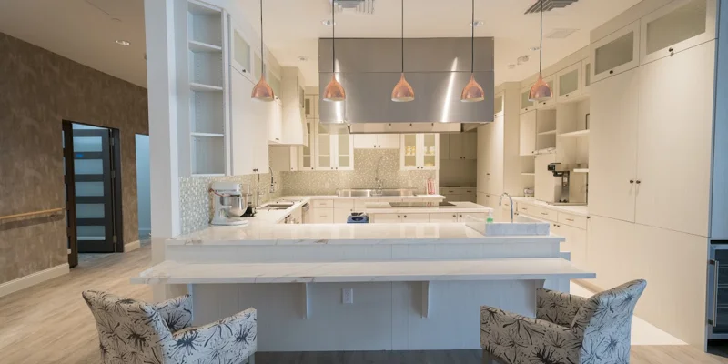 Spacious kitchen with modern appliances and marble countertops.