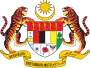 Shield showing the symbols of the Malaysian states with a star and crescent above and a motto below, supported by two tigers