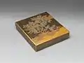 Edo period 18th-century suzuri-bako depicting a warbler in a plum tree, made in lacquered wood with gold and silver inlay
