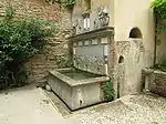 Fountain at the east end of the garden, with aquatic imagery