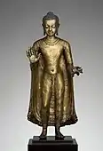 Gupta sculpture of Buddha offering protection; late 6th–early 7th century; copper alloy; height: 47 cm, width: 15.6 cm, diameter: 14.3 cm; from India (probably Bihar); Metropolitan Museum of Art