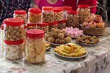 Image 40Aside from mandarin orange, various other snacks are presented for visitors throughout the Chinese New Year. (from Malaysian Chinese)
