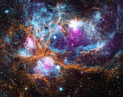 Image 5NGC&nbsp;6357Photograph credit: NASANGC&nbsp;6357 is a diffuse nebula in the constellation Scorpius. This composite image of the nebula contains X-ray data from the Chandra X-ray Observatory and the ROSAT telescope (purple), infrared data from the Spitzer Space Telescope (orange), and optical data from the SuperCosmos Sky Survey (blue). Radiation from hot, young stars is energizing the cooler gas in the clouds that surround them. Often known as the Lobster Nebula, the astronomical object has also been termed the Madokami Nebula by fans of the anime Madoka Magica due to its supposed resemblance to the main character. Scientists at the Midcourse Space Experiment prefer the name War and Peace Nebula, because the bright, western part resembles a dove, while the eastern part looks like a skull in infrared images.More selected pictures