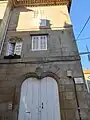 Façade with window with ogee arch decorated with interlace