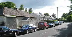 Former village school and estate cottages.