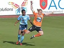 Spencer (left) playing for Sydney FC, 2014