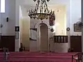 The prayer hall of the modern mosque, with mihrab and minbar visible