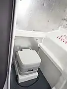 Heads in port tank space