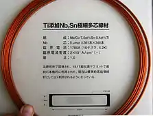 Nb/Cu-7.5at%Sn-0.4at%Ti tape (9.5×1.8&nbsp;mm cross section) originally developed for an 18.1&nbsp;T magnet. Nb core: 361×348 packs of 5&nbsp;µm dia. filaments. Critical current 1700&nbsp;A (16 tesla, 4.2&nbsp;K), critical current density 20&nbsp;kA/cm2