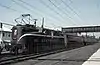 Pennsylvania Railroad GG1 number 4932 leads train 111 at South Amboy, NJ, on November 3, 1965
