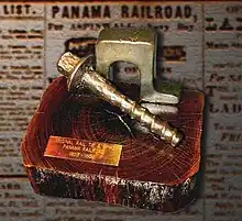 Example of the original construction 53&nbsp;lb/yd (26&nbsp;kg/m) inverted "U" rail aka "Bridge" rail, "screw" spike, and lignum vitae tie used to build the Panama Railroad from 1851 to 1855.