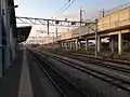 View from platform 4, showing the passing loop and sidings to the east (right) and the elevated Shinkansen tracks.