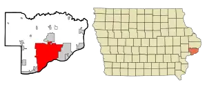 Located on the center south border of a county that is on southern side of the hump on the eastern border of Iowa.