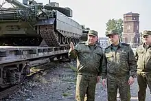Russian Minister of Defence, General Sergei Shoigu (In the middle), wearing an office uniform in EMR