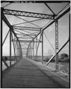 View: Looking south, showing deck, vertical, upper strut and bracing detail