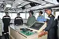 VAdm. S.&nbsp;P.&nbsp;S. Cheema and Air Marshal BS Dhanoa being briefed by Kumar