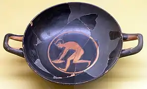 Saltador con halteras. Kílix ático de figuras rojas, ca. 510&nbsp;a.&nbsp;C. Museo del Ágora de Atenas.