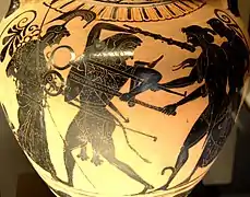 Ánfora de cerámica de figuras negras, que representa la disputa entre Apolo y Heracles por el trípode de Delfos. Relacionada con el denominado Grupo de Toronto 305. Hacia 510&nbsp;a.&nbsp;C.