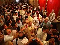 Archbishop Ezzati greets the faithful.