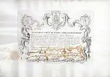 Acción de la Companhia Real de Toledo unida a la de Extremadura por 3.000 reales vellón, emitida el 6 de diciembre de 1751 en Toledo, impresa en pergamino de becerro. La compañía, fundada en 1748, explotaba plantaciones de moreras y cría de gusanos de seda, producía seda y también comerciaba con armas.
