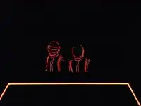 Daft Punk wearing light-up outfits