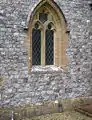 Una iglesia de sílex - la Iglesia parroquial de Santo Tomás, en Cricket Saint Thomas, Somerset, Inglaterra. La altura de los bloques de sílex muy bien tallados varía entre 3 y 5&nbsp;cm.