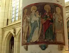 Fresco de comienzos del siglo&nbsp;XVI (de izquierda a derecha: Juan Bautista, Santa María con el niño Jesús, San Juan Evangelista, San Didier sosteniendo su cabeza decapitada). Se ve un pasaje de Champagne en el pilar lateral en alto a la izquierda.