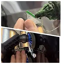 La abolladura se elimina con pegamento aplicado a la lengüeta de plástico y adherido al vehículo