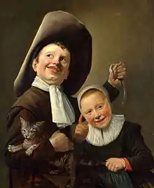Un niño y una niña con un gato y una anguila