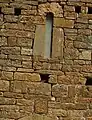 Detalle de la fachada de San Pablo, con crismón.