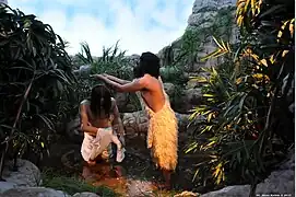 Escena 10: San Juan Bautista y el bautismo de Jesús en el río Jordán