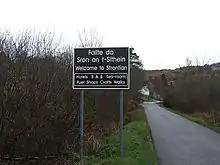 Seña de bienvenida en Estroncia