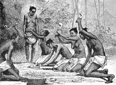 014-WOMEN OF KAMBALA CENTRAL AFRICA CRUSHING GRAIN.jpg