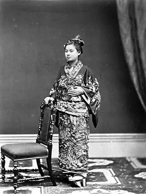 Japanese Woman Holding a chair