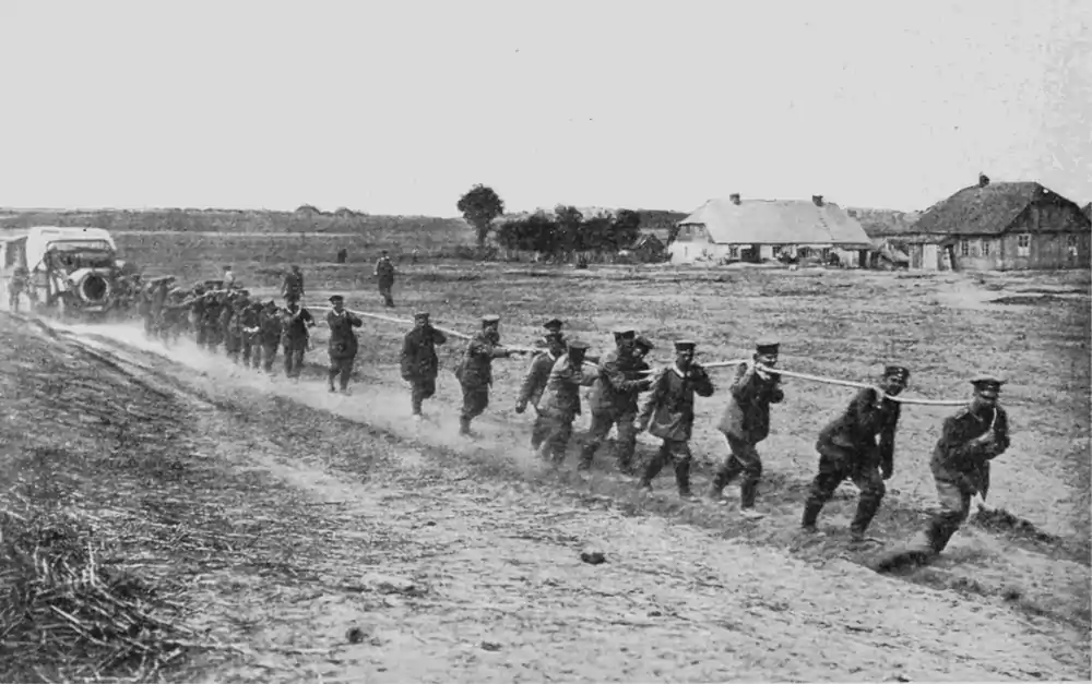 image of soldiers pulling a truck out of the swamp