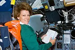 Astronaut looking at a checklist