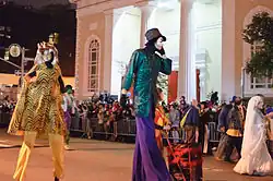 Children in costumes walking in the street