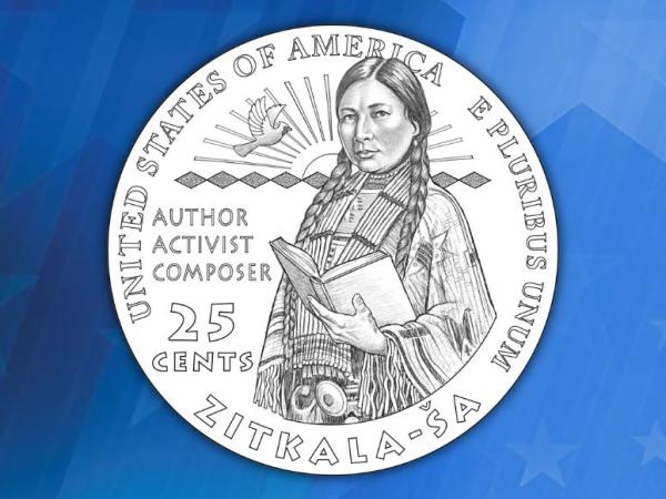 Design of the quarter with Zitkala- Ša from the waist up holding a book. The words “author, activist, composer” are beside her. 