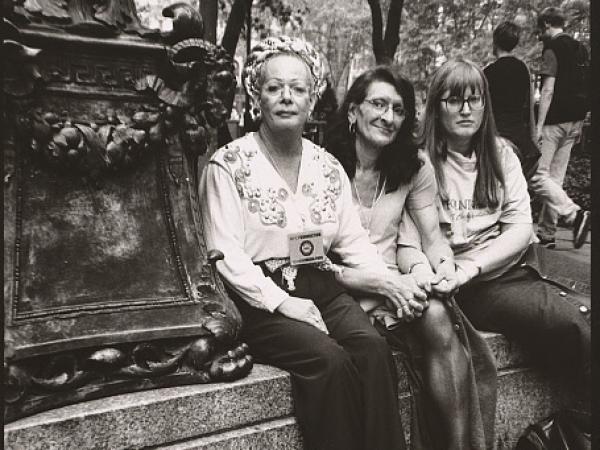 Sylvia Rivera sits flanked by her partner Julia Murray (right) and activist Christina Hayworth at the Saturday Rally before New York’s Gay Pride Parade