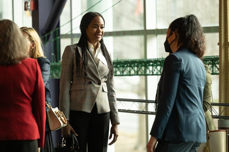 A candid photo of two women in conversation.