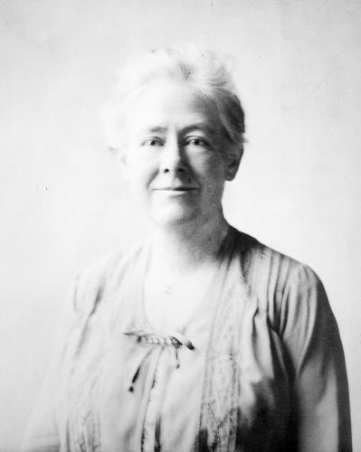 Formal portrait of Mary Vaux Walcott from the waist up looking directly at the camera. 