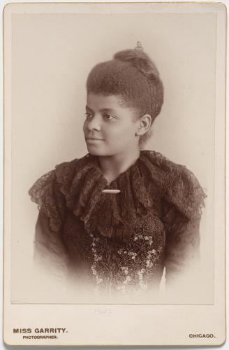 Portrait of Ida B. Wells from the waist up in 3/4th profile.