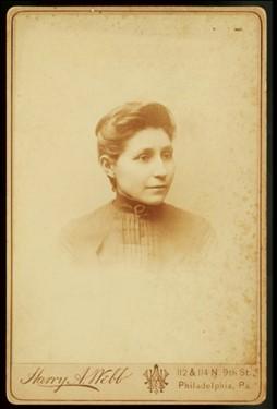 Black and white portrait of Susan La Flesche Picotte on a photo card from the shoulders up.