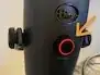 A physical microphone mute button