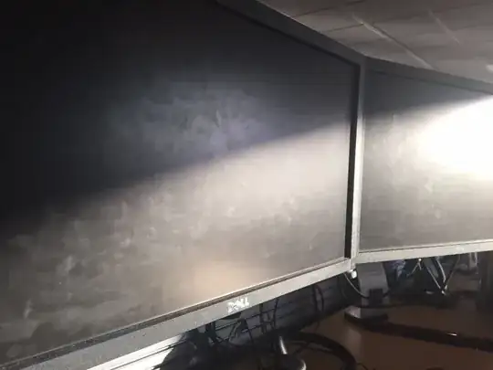 A neighboring screen covered in smudges
